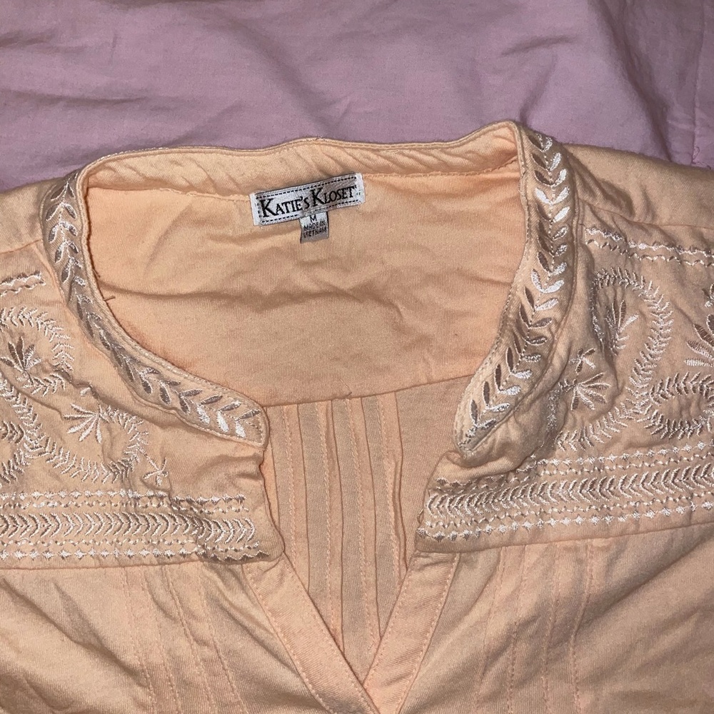 Peach tank top with white embroidery